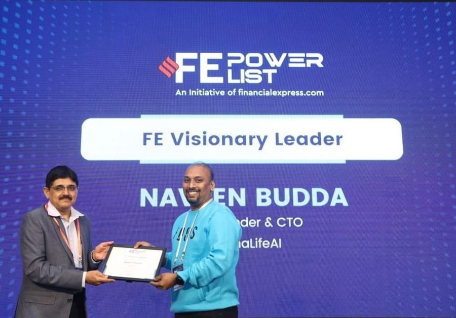 Naveen Budda on stage receiving the Financial Express Power List 'FE Visionary Leader' award.